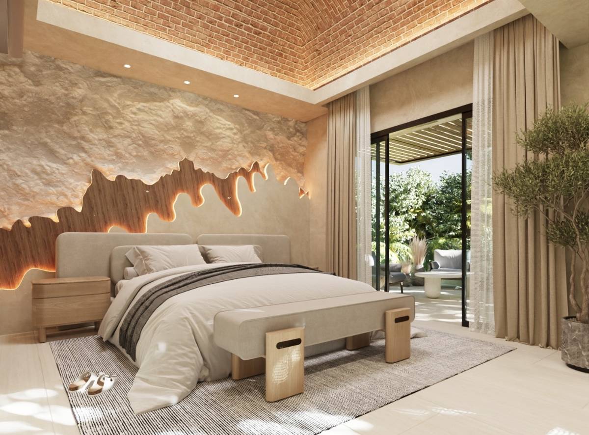 Suite at Casa Árbol — brick vault, sculpted chukum wall with a backlit wood inlay, garden terrace